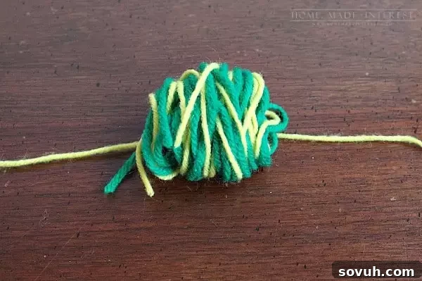 This simple craft tutorial on how to make yarn pom poms will change your life! You’ll want to put yarn pom poms everywhere! They are great for party decorations, garlands and banners, and cupcake toppers! 