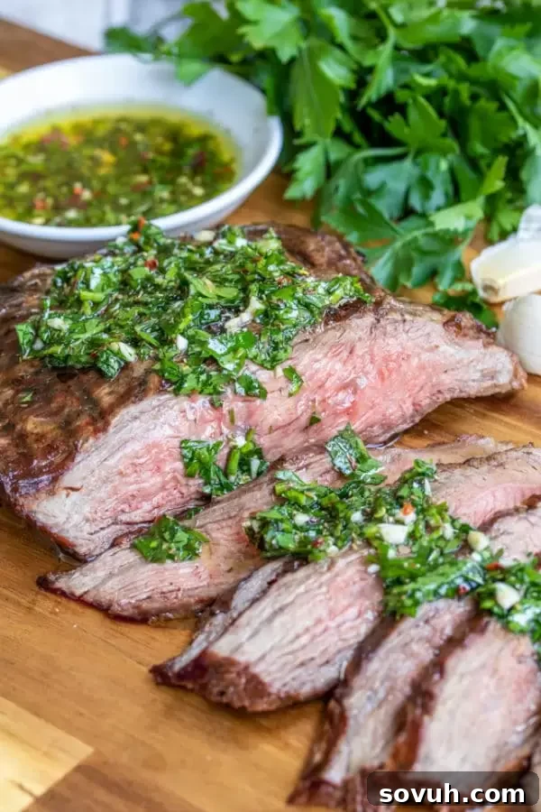 Whip Up Flavorful Chimichurri 4 Homemade Chimichurri sauce poured generously over a perfectly grilled steak, highlighting the vibrant herbs and delicious texture.
