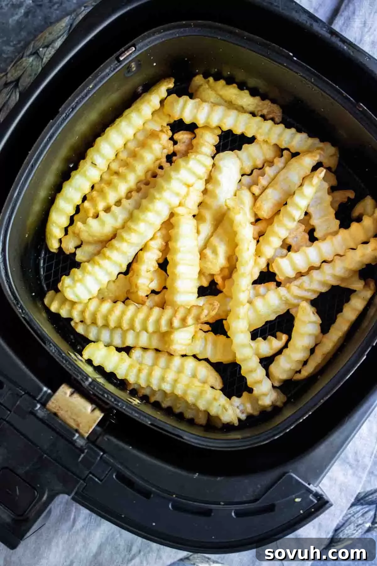 crinkle Air Fryer Frozen French Fries in air fryer basket