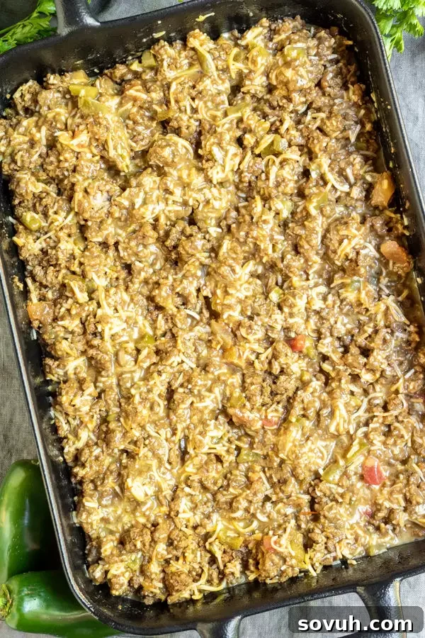 Close-up of the Keto Taco Casserole mixture with cheese before baking