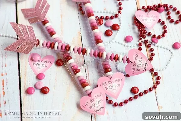 Handmade Valentine's Day Cupid's Arrows with festive candies, ideal for kids and adults alike.