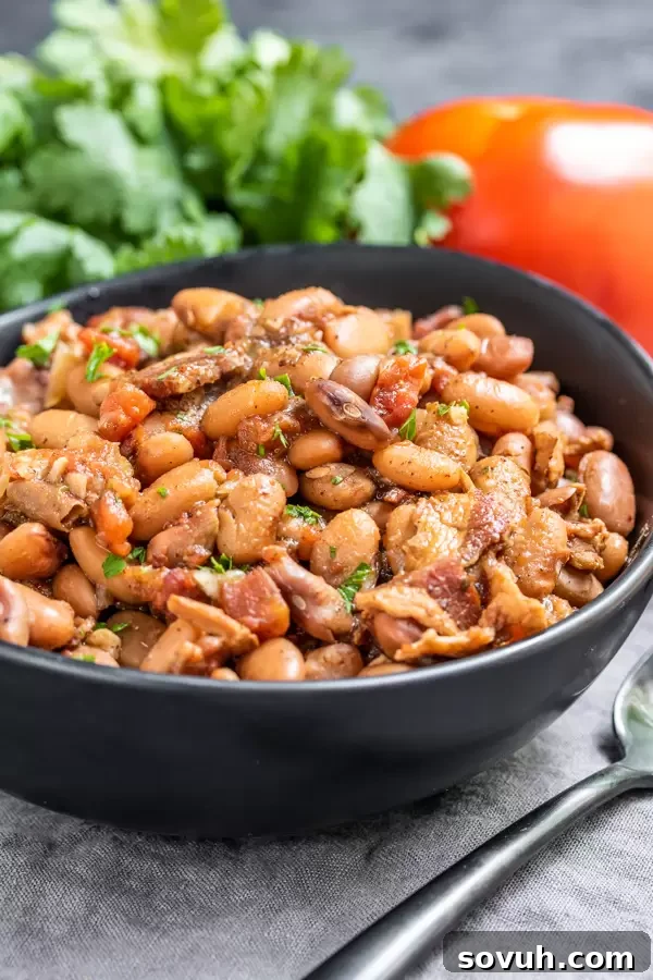 A full pot of Instant Pot Pinto Beans, ready to be served, making a perfect side recipe for BBQs or any family gathering.