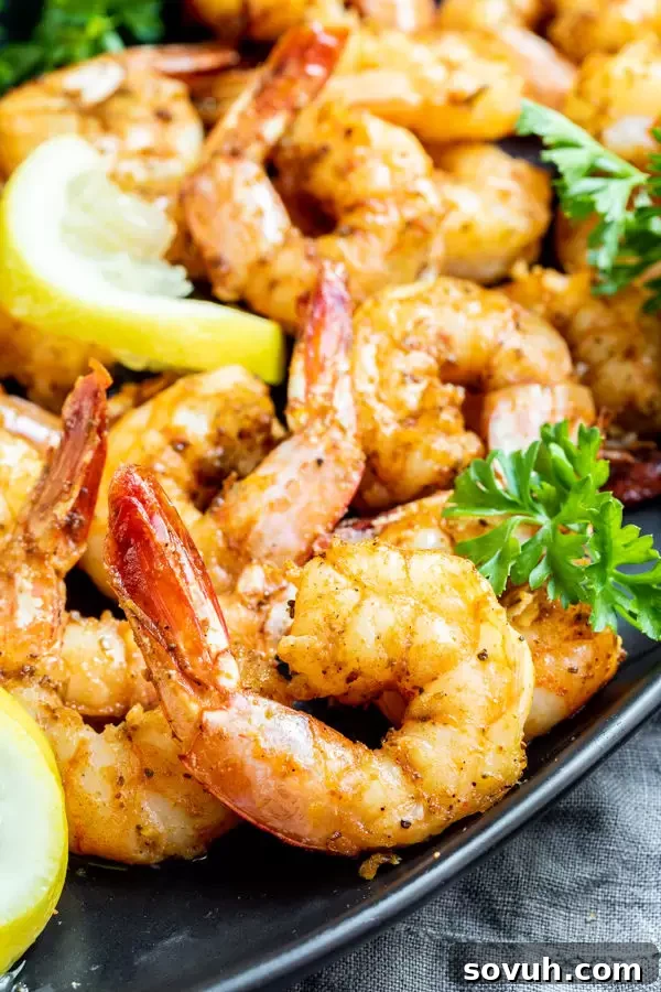 Easy Air Fryer Shrimp served in a bowl with lemon