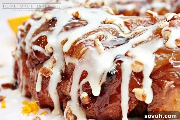 A closer shot of the Orange Caramel Pecan Monkey Bread, highlighting the rich orange glaze and the irresistible pull-apart texture, making it a perfect breakfast treat.