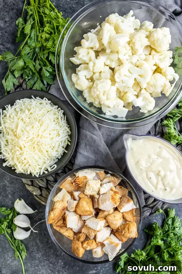 A selection of fresh ingredients laid out for Keto Chicken Alfredo Casserole preparation.
