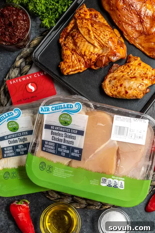 Aromatic Harissa Glazed Chicken 5 Chicken pieces thoroughly coated in a vibrant harissa marinade, ready for cooking.