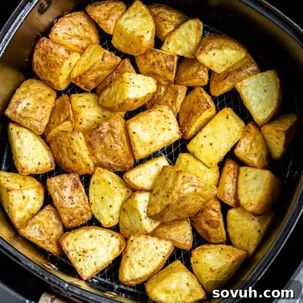 air fryer basket with Crispy Air Fryer Potatoes