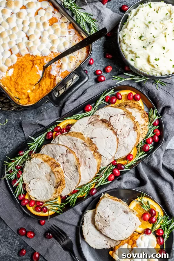 A festive Thanksgiving dinner spread featuring a platter of sliced Instant Pot Turkey Breast, alongside classic side dishes like mashed potatoes, green beans, and cranberry sauce.