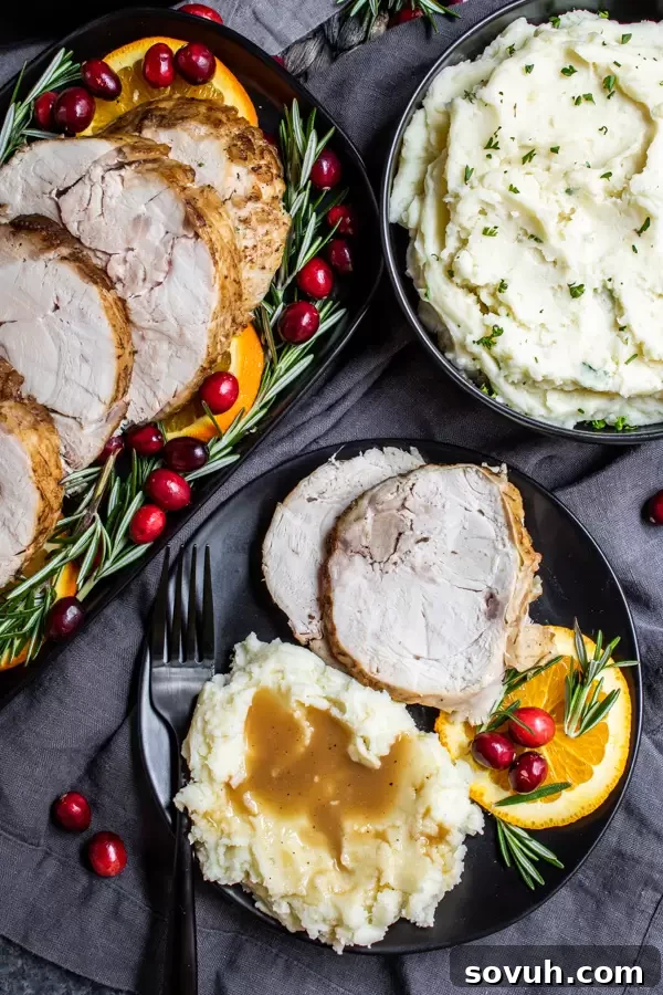 A serving of creamy Instant Pot Mashed Potatoes, garnished with fresh herbs, showcasing a perfect side dish for turkey dinner.