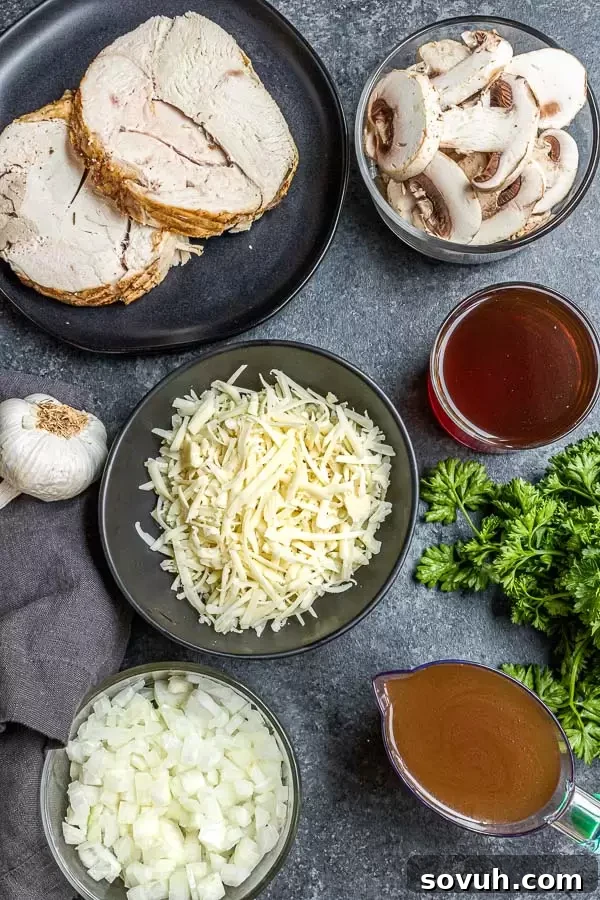 Succulent Turkey Marsala 3 Fresh ingredients for Turkey Marsala including sliced mushrooms, diced onions, minced garlic, butter, and a bottle of dry Marsala wine, ready for cooking.