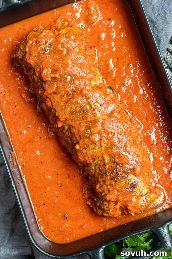 Beef Braciole covered in sauce
