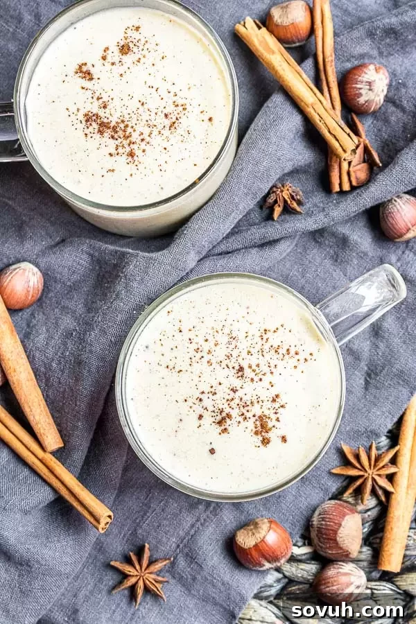 two cups of Keto Eggnog with cinnamon and nutmeg