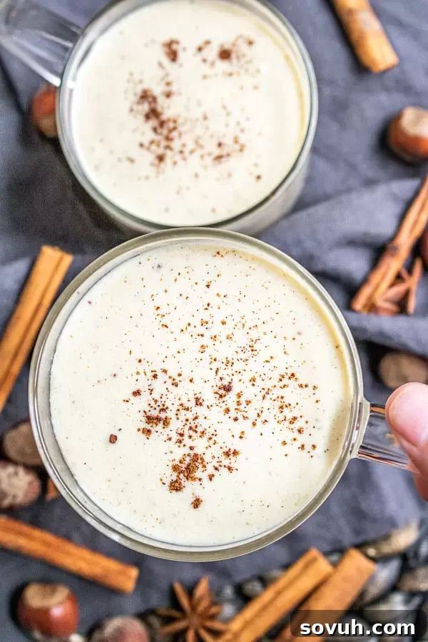 holding a cup of Keto Eggnog