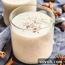 Keto Eggnog in a cup with cinnamon on top