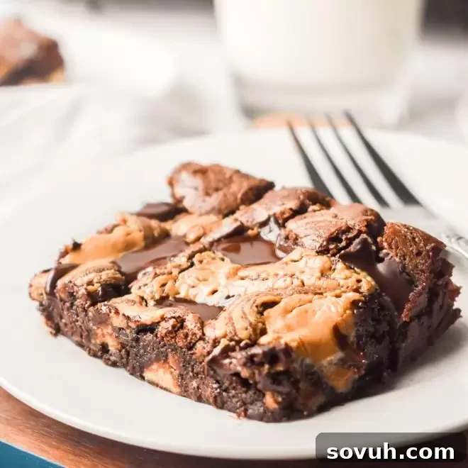 Homemade Dark Chocolate Peanut Butter Brownie on a plate with a fork, showing its rich, fudgy texture.