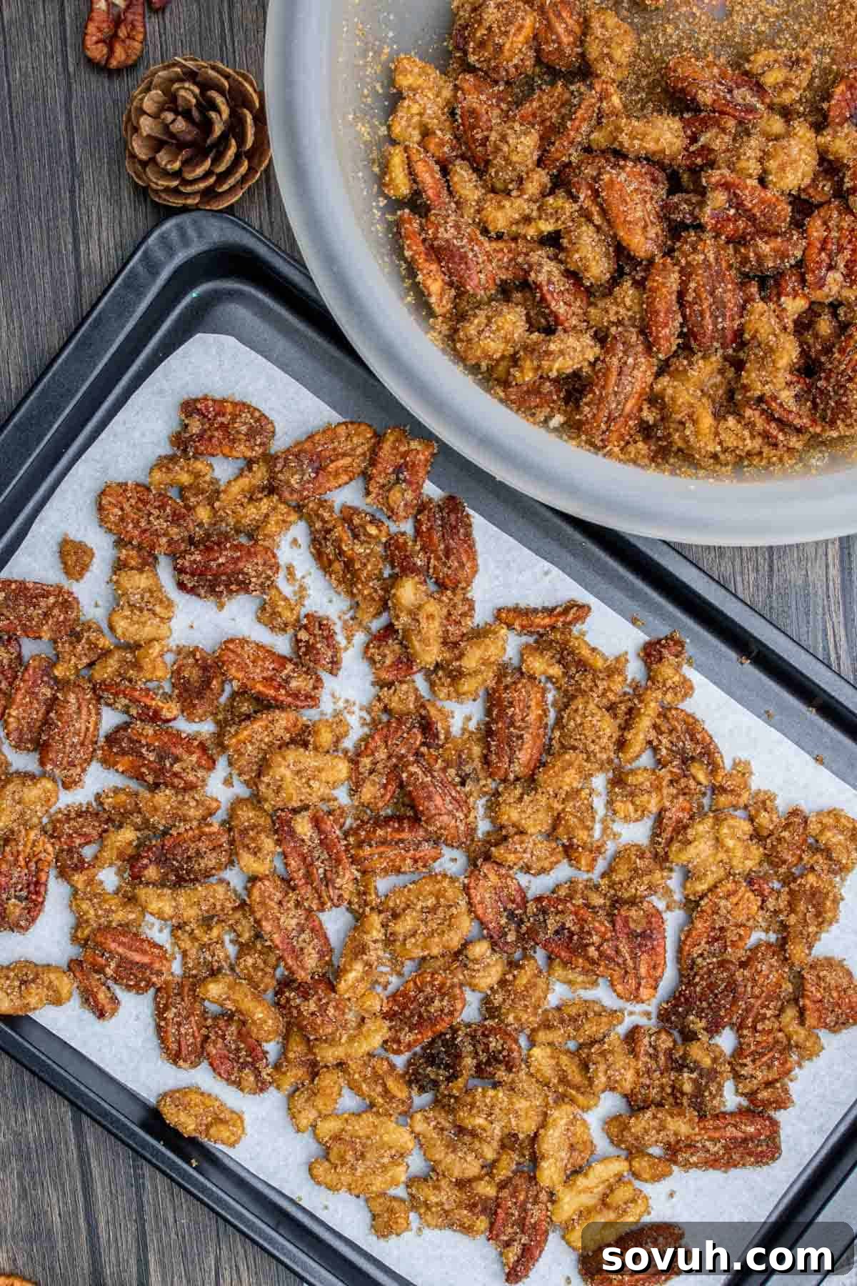 The process of making candied nuts, showing nuts being transferred to a baking sheet after coating.