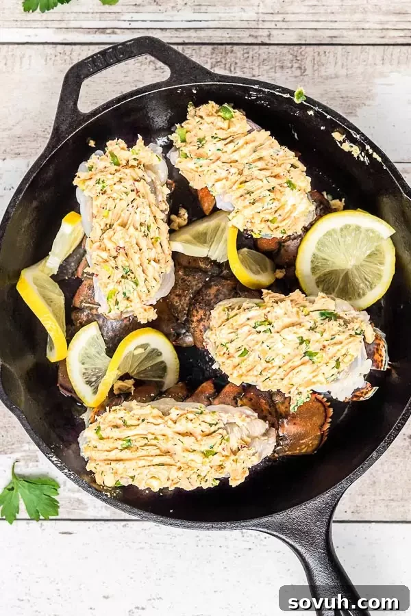 Broiled Lobster Tail generously topped with a rich seasoned herb butter before cooking