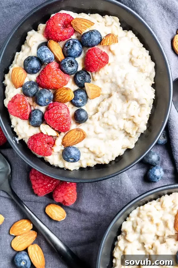 A vibrant bowl of Instant Pot Oatmeal, topped generously with mixed berries and a delicate drizzle of honey, showcasing a delightful breakfast.