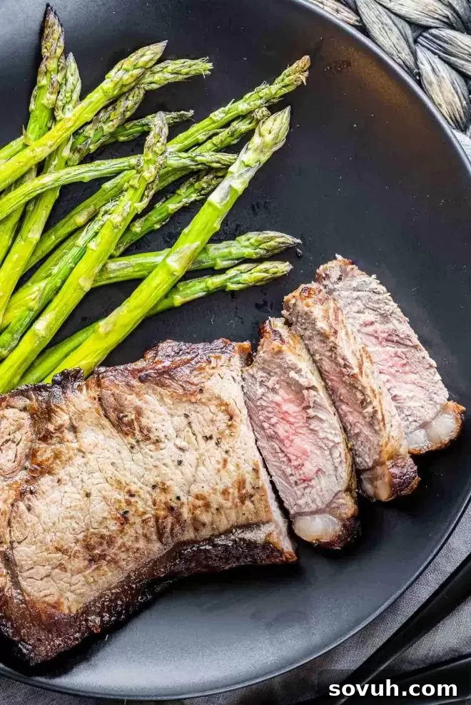 Air Fryer Steak slice on a black plate