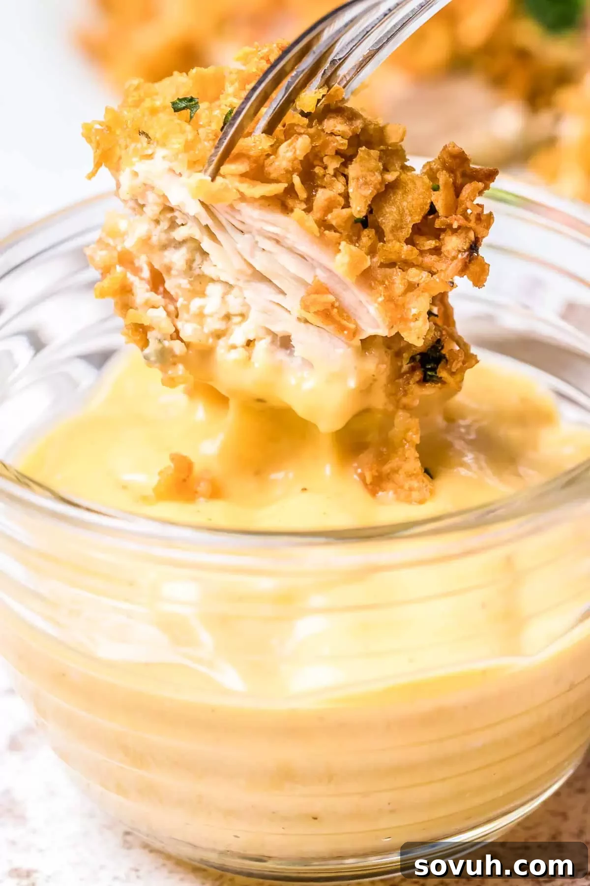 dipping Cornflake Chicken in honey mustard