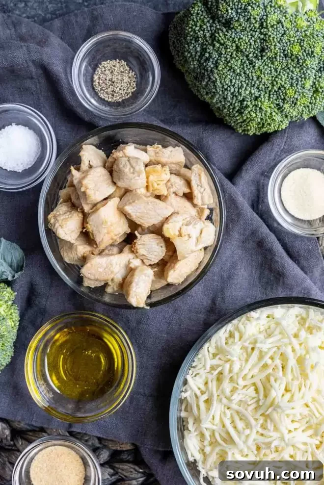 Ingredients for Keto Chicken and Broccoli Alfredo Casserole laid out on a counter