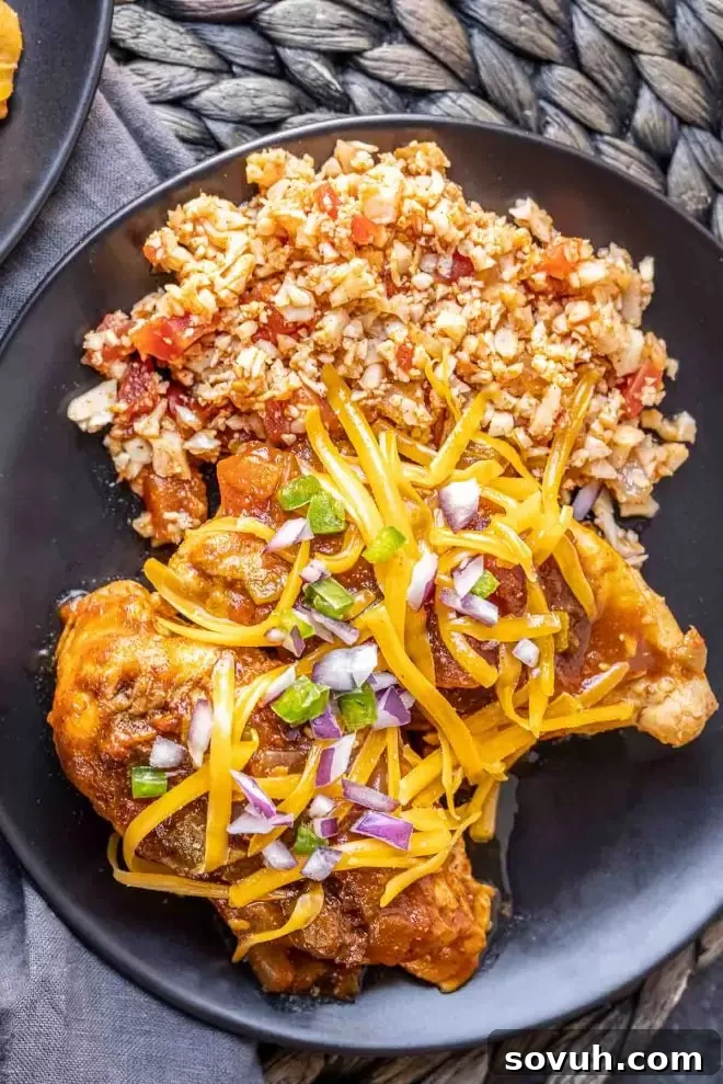 Instant Pot Salsa Chicken on a plate with Spanish cauliflower rice and cilantro