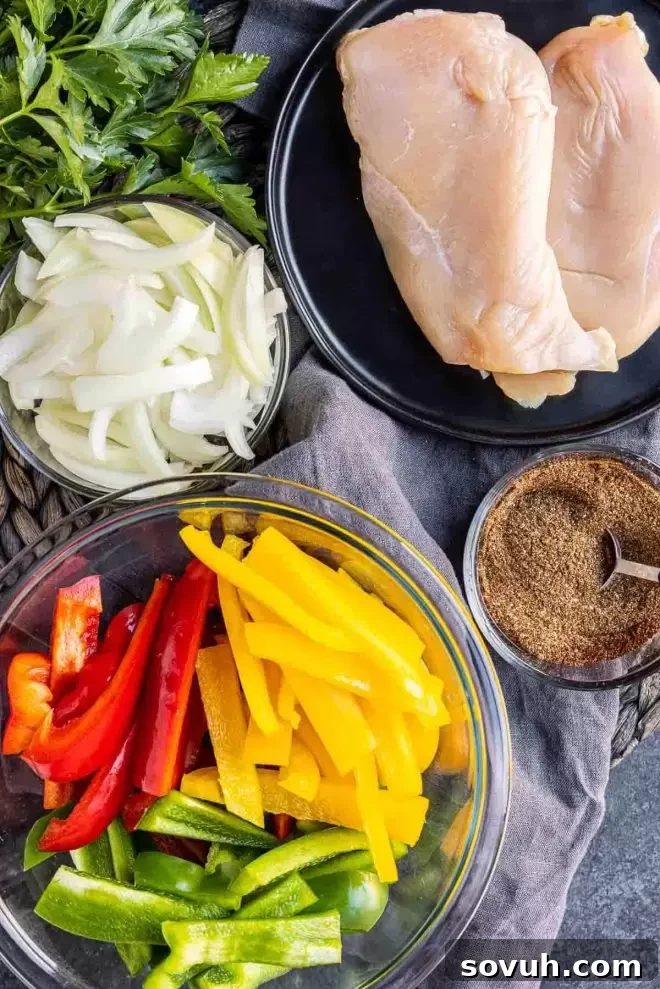 One-Pan Chicken Fajita Bake 3 Fresh ingredients for Oven Chicken Fajitas including sliced chicken, bell peppers, and onion