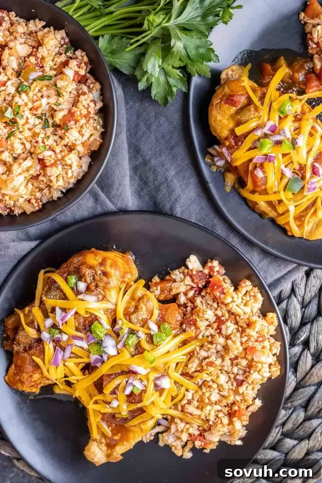 Spanish Fiesta Keto Cauliflower Rice 5 A delicious plate of Instant Pot Salsa Chicken, generously topped with fresh cilantro, served alongside a healthy portion of Keto Cauliflower Spanish Rice. A perfect keto-friendly meal.