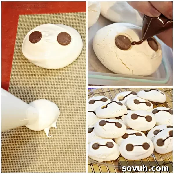 Adorable Baymax meringue cookies featuring chocolate chip eyes and connecting line, inspired by the Big Hero 6 character, perfect for themed parties.