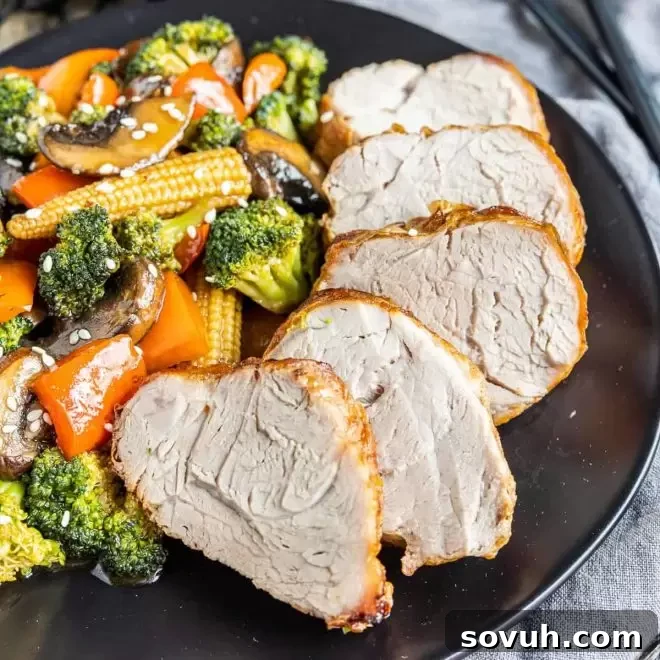 sliced Air Fryer Pork Tenderloin on a plate