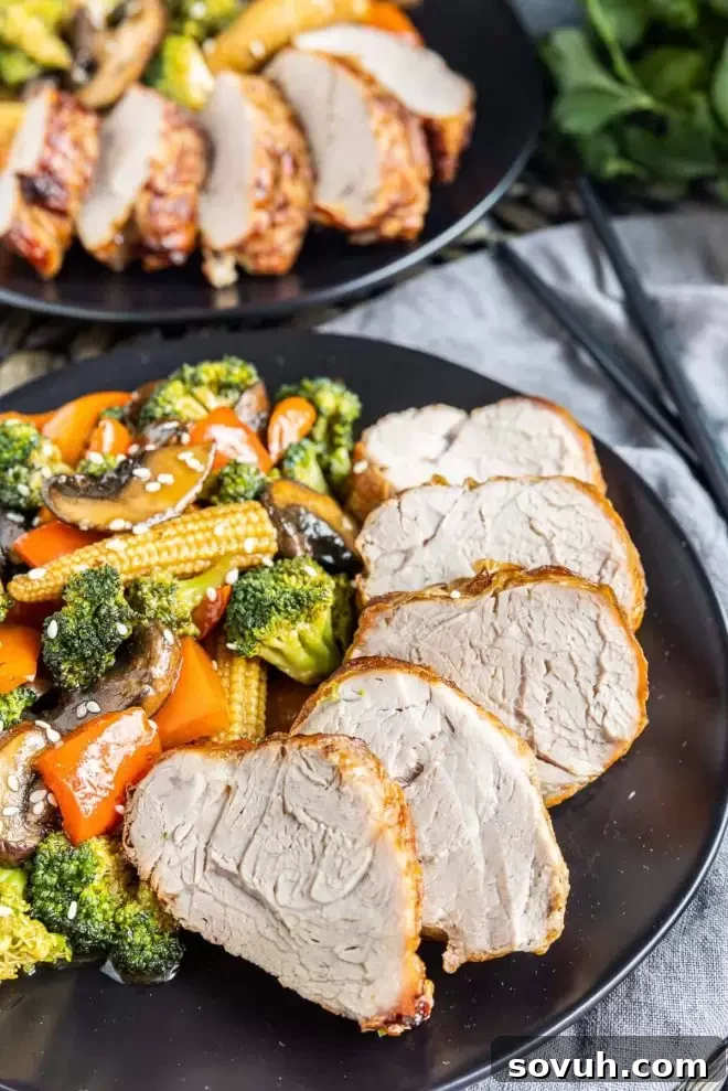 slice Air Fryer Pork Tenderloin on a plate