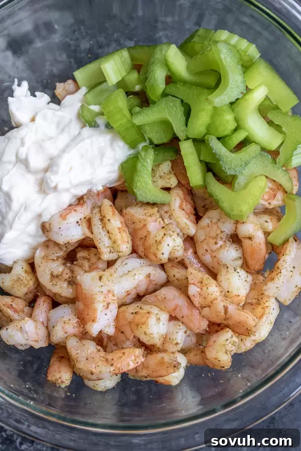 All the fresh ingredients laid out on a board, ready to be combined for the delicious shrimp salad.