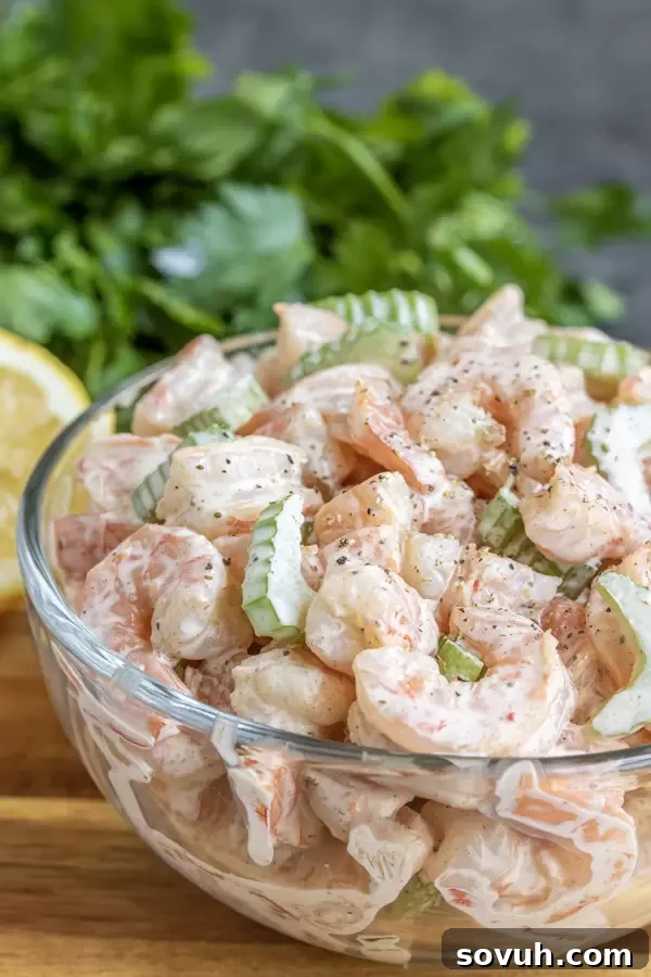 A large bowl filled with freshly made creamy shrimp salad, ready to be served or stored.