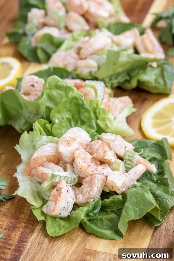 Two crisp lettuce cups filled with creamy keto-friendly shrimp salad, a perfect light meal.