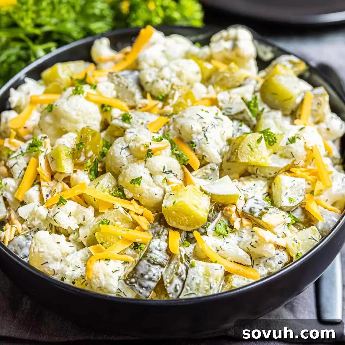 Keto Dill Pickle Salad in a black bowl