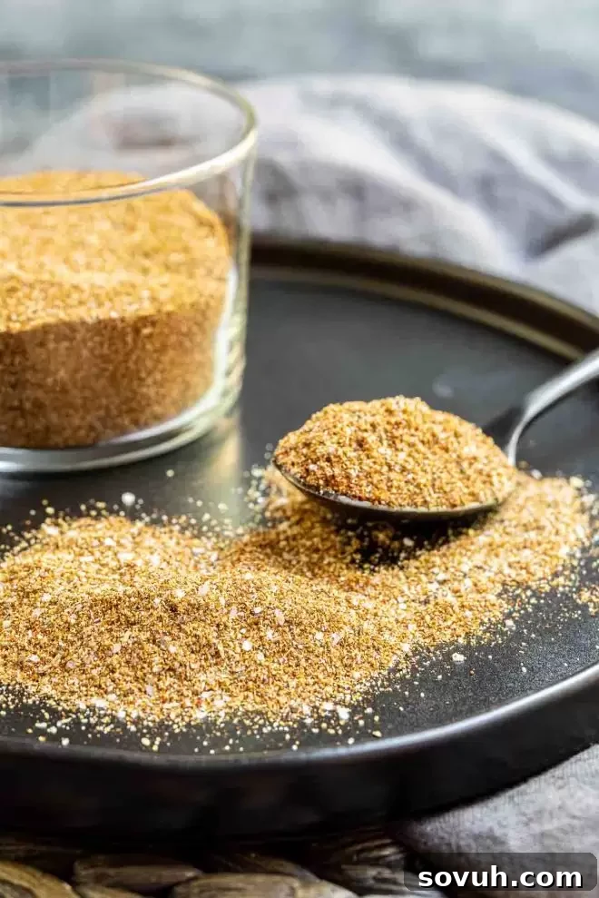 Homemade Fajita Seasoning on a plate with a spoon, ready for use