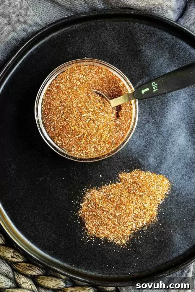 Blackened Seasoning in a cup with a 1 tsp scoop