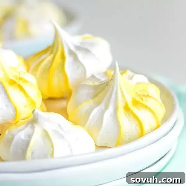 Light and crispy Lemon Meringue Cookies with a beautiful yellow swirl, a delicate and flavorful treat.