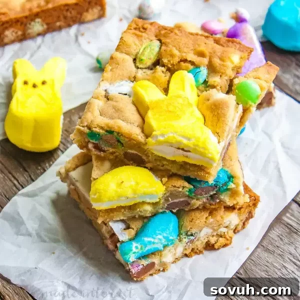 A vibrant pan of Easter Candy Blondies, loaded with Peeps and various leftover Easter candies, showcasing a fun, chewy texture.