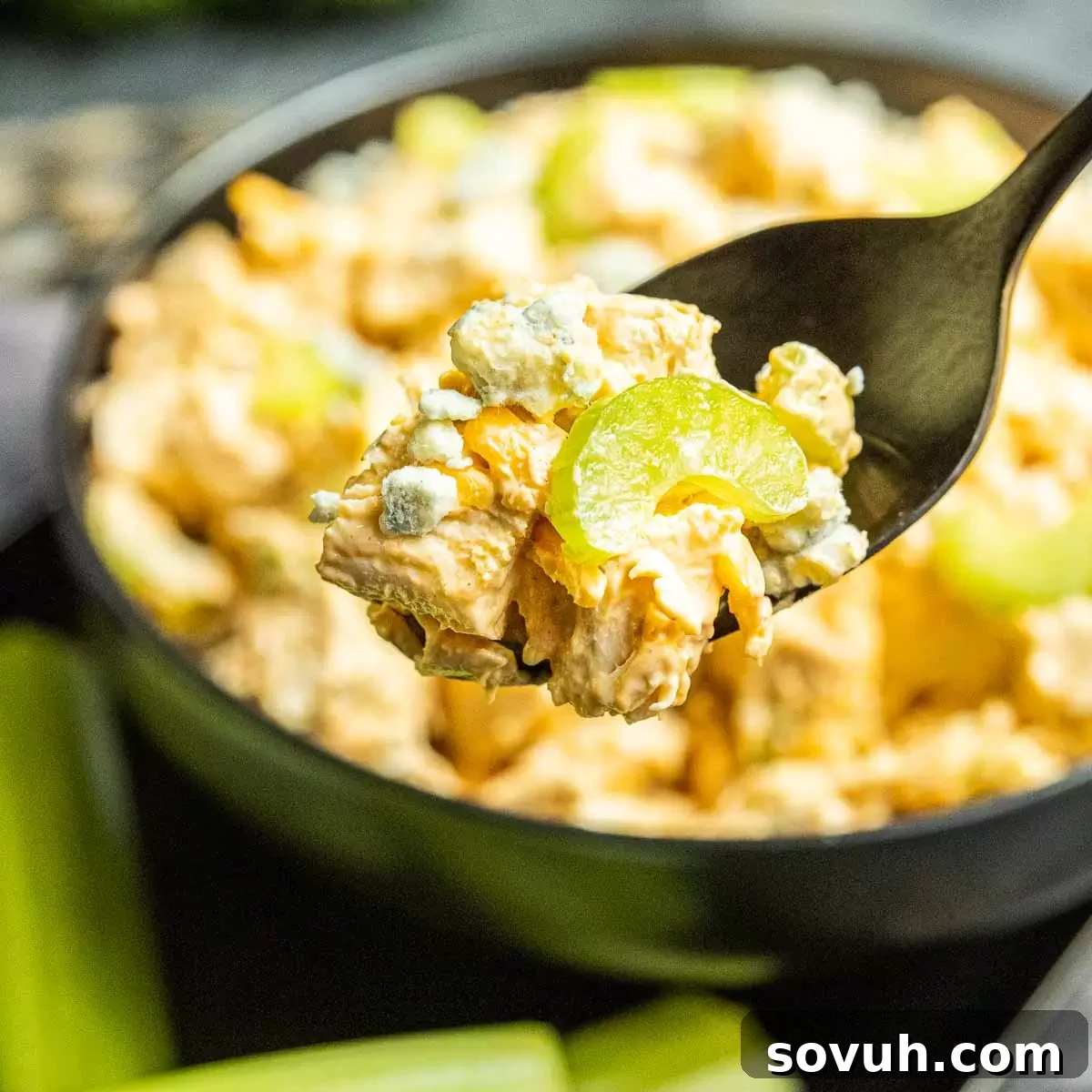 Buffalo Chicken Salad on a spoon, showcasing its creamy, spicy texture