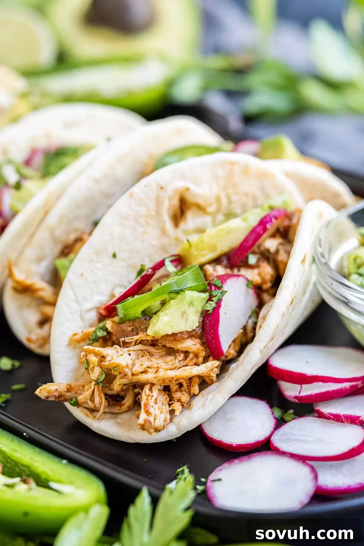 Instant Pot Chicken Tacos on platter with sliced radish