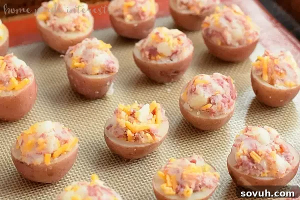 A step-by-step image demonstrating how to scoop out potato flesh and flatten the bottoms of the potato halves for Irish Potato Bites.