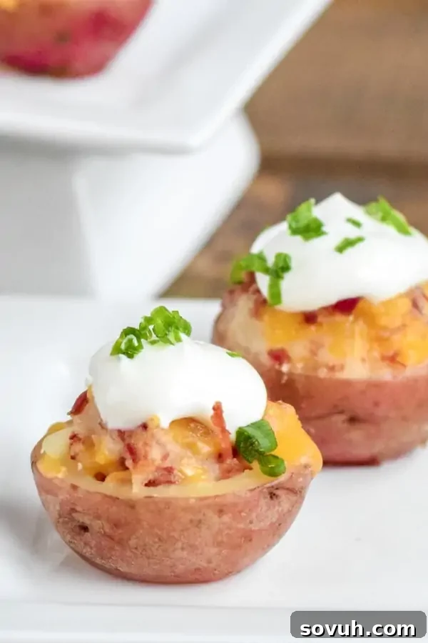 A baking sheet filled with golden-brown Irish Potato Bites, freshly out of the oven, ready to be served as St. Patrick's Day appetizers.