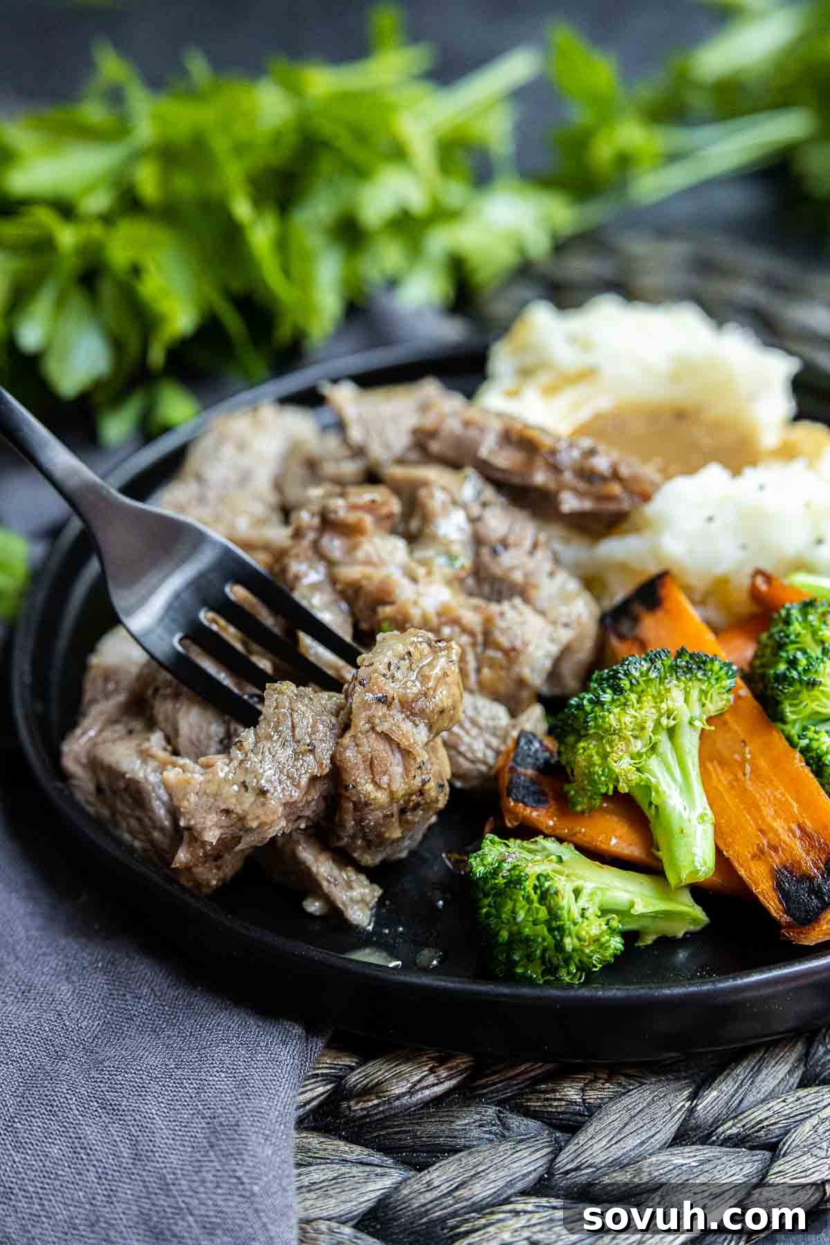 Instant Pot Pork Roast on a plate with mashed potatoes and green beans