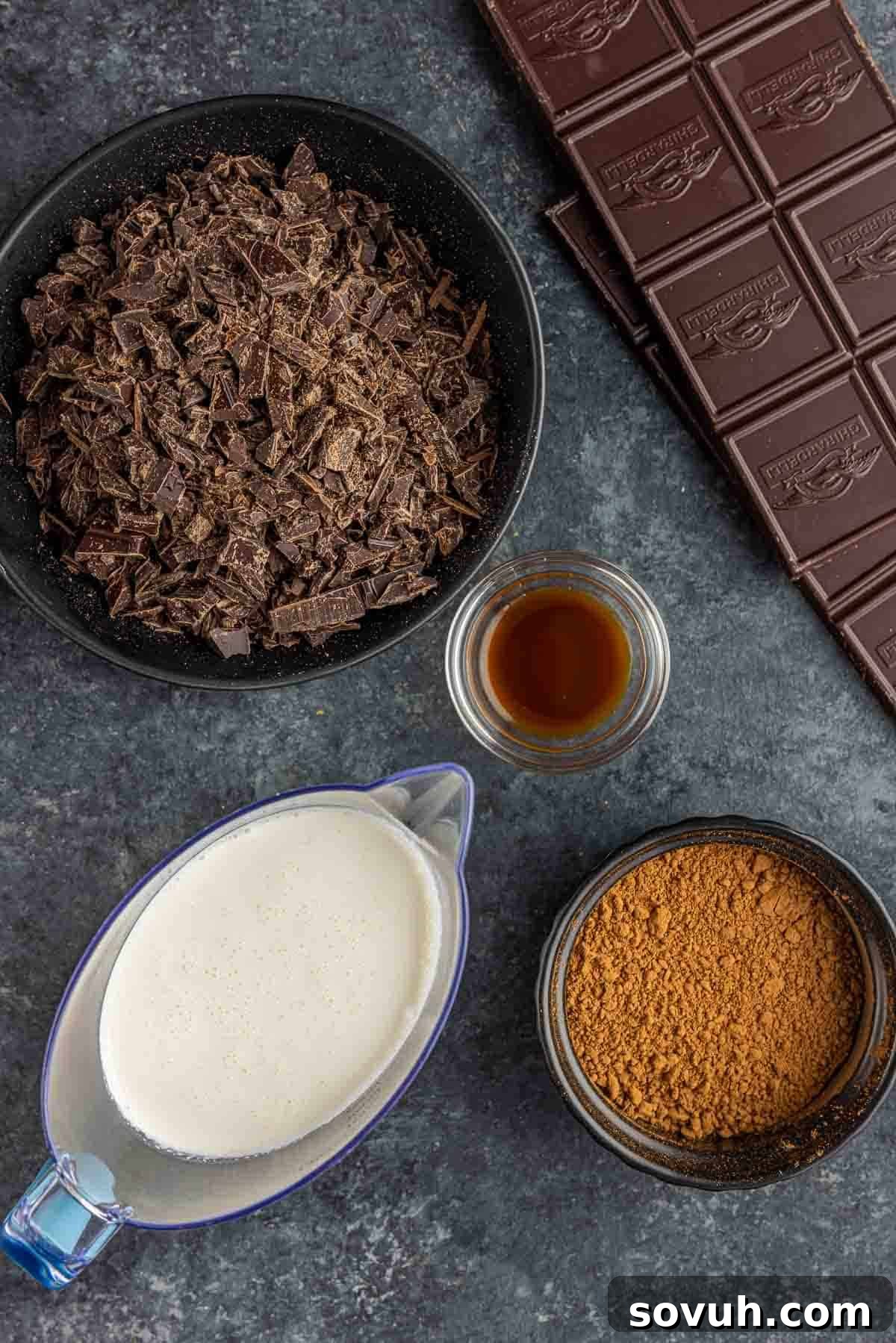 A selection of high-quality ingredients including dark chocolate, heavy cream, and vanilla extract for making homemade chocolate truffles.