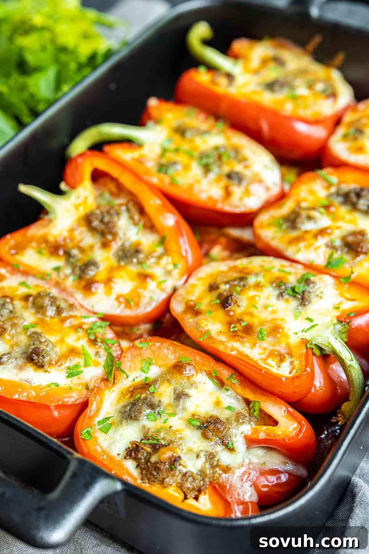 Lasagna Stuffed Peppers half filled with a rich meat and cheese mixture, showcasing the layers before baking.