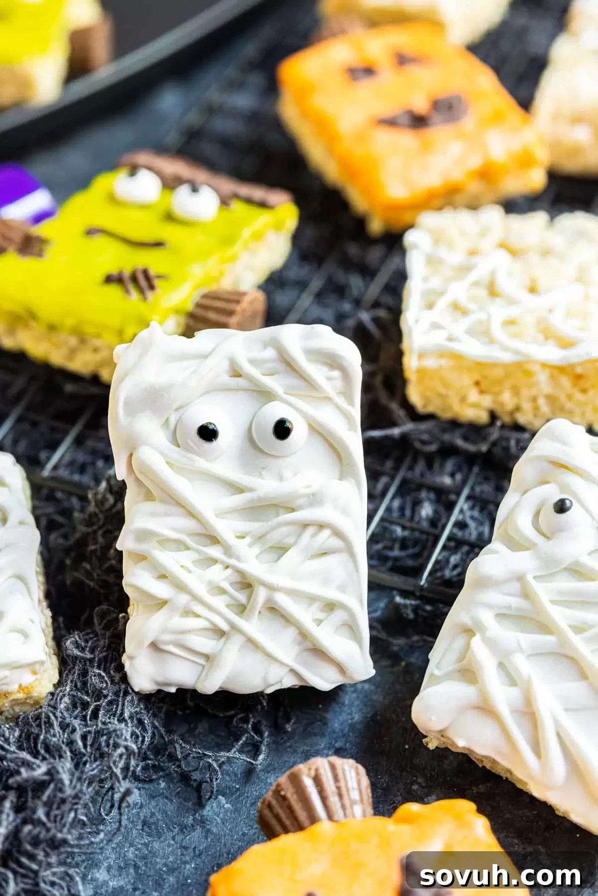 A delightful Mummy Rice Krispies Treat, wrapped in white candy melts and adorned with candy eyes.