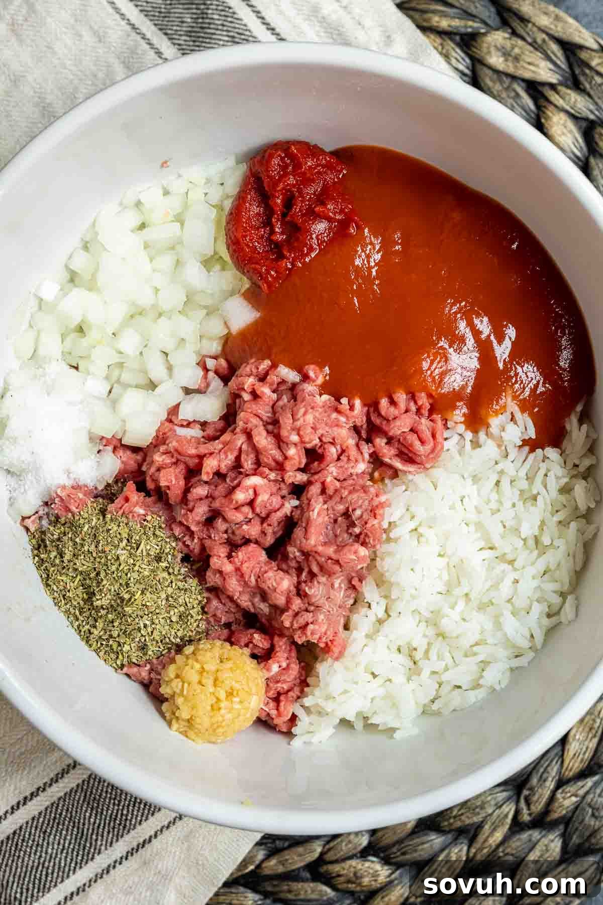 Ground beef and rice mixture in a bowl, ready for stuffing bell peppers