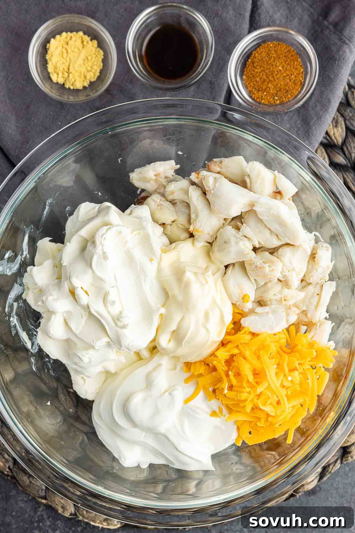 Maryland Crab Dip ingredients in a glass bowl