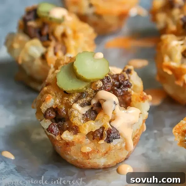 These Cheeseburger tots are tater tot bites filled with hamburger, cheese, pickles, and a special sauce. It’s like a bite size Big Mac served in a tater tot cup! This is an easy game day recipe for your upcoming super bowl party! It is an easy party food recipe that is going to wow your friends and family. Tater tots + Cheeseburger = instant winner!